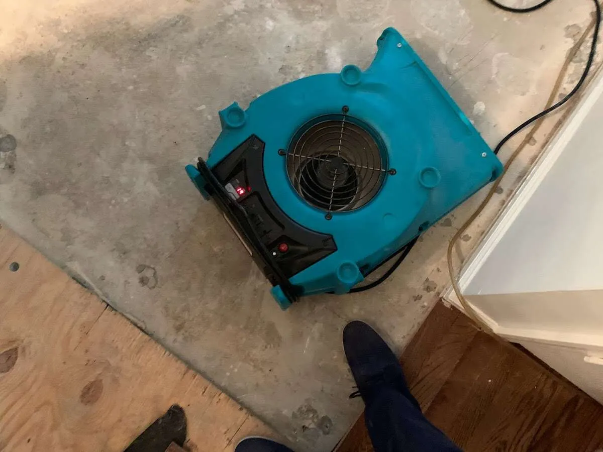 Air mover drying subfloor during Leak Detection & Repair in Bonner Springs